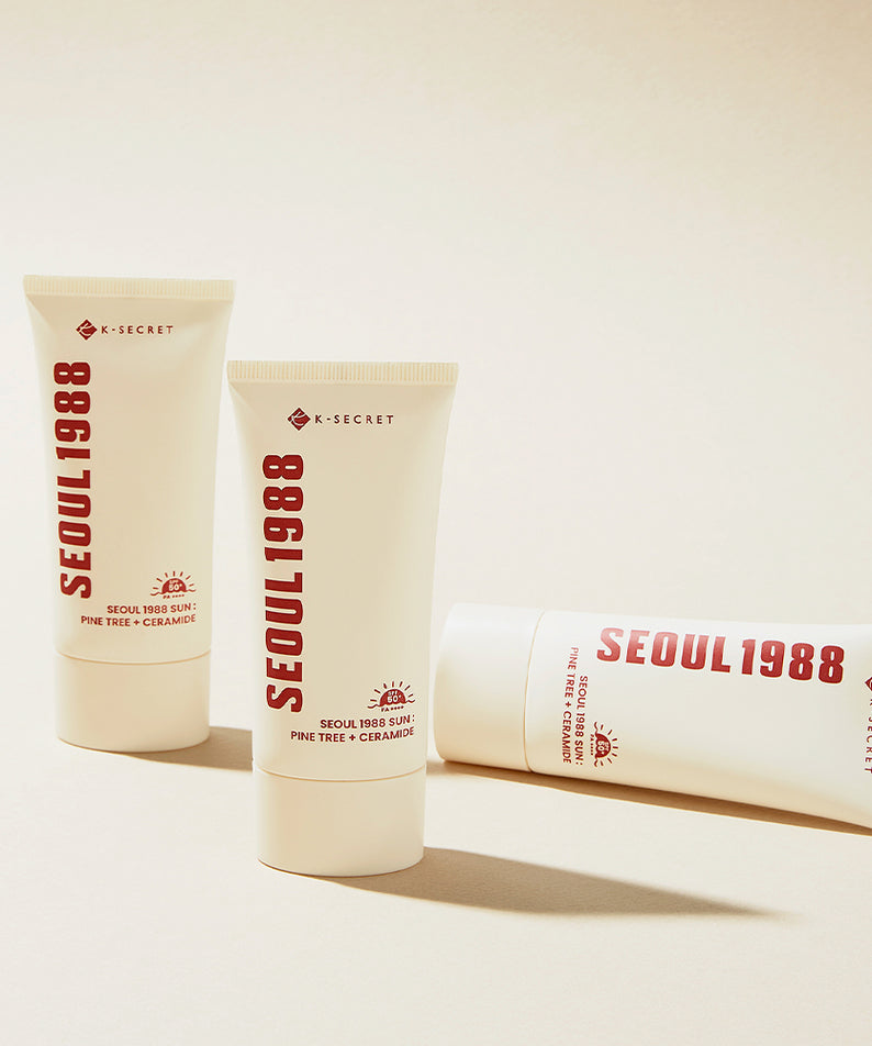 SEOUL 1988 Pine Sunscreen 50ml, marque X-Secret, tubes crème solaire posés sur fond clair en studio