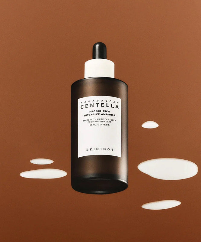 SKIN1004 Madagascar Centella Probio-cica Intensive Ampoule 50ml de la marque SKIN1004, flacon noir sur fond orange