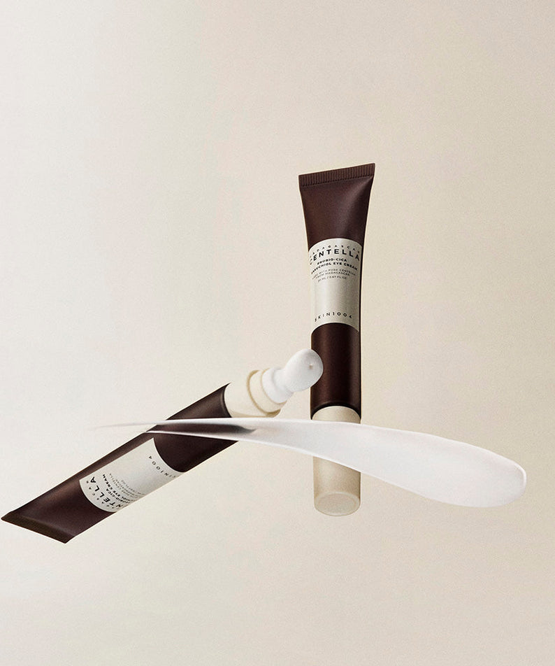 Crème pour les yeux SKIN1004 Madagascar Centella Probio-cica Bakuchiol 20ml avec applicateur en fond beige.