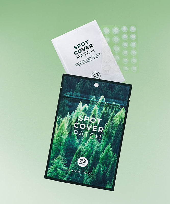 SKIN1004 Spot Cover Patch 22patch sur fond vert, idéal pour traiter les imperfections de la peau.