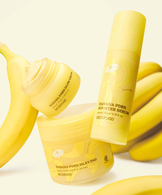 SKINFOOD Banana PDRN Silky Pad 60 sheets, marque SKINFOOD, avec bananes en arrière-plan, photo produit jaune.