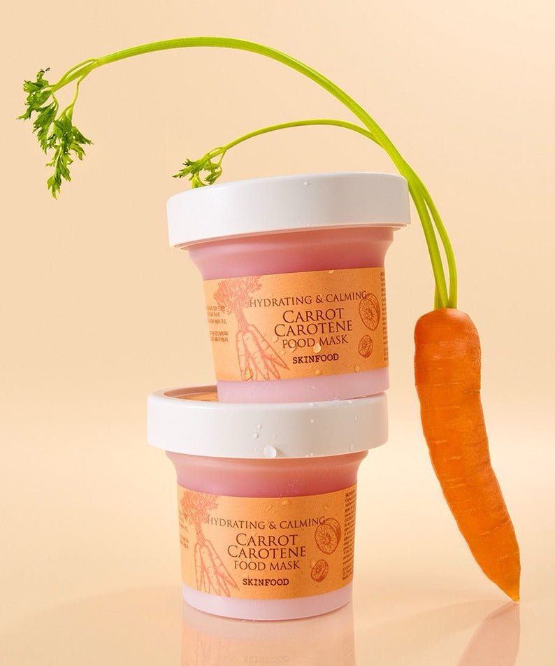 SKINFOOD [NEW ] Carrot Food Mask 120g de SKINFOOD, masques en pots, carotte et tiges vertes sur fond clair