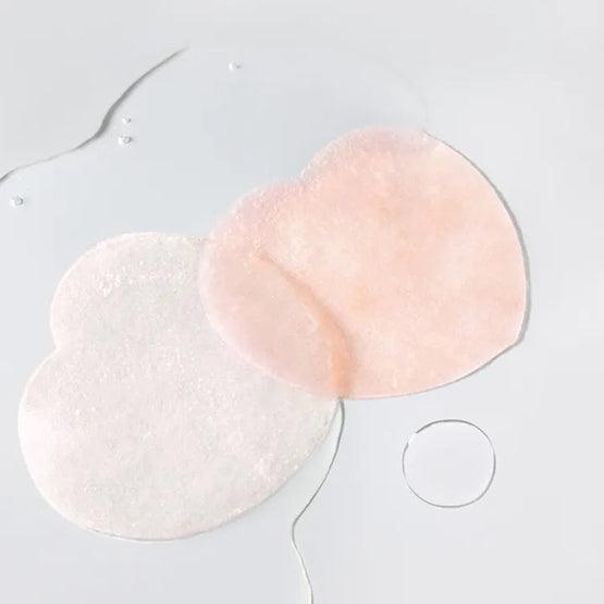 SKINFOOD [NEW] Peachy Zinc PCA Pad 70 sheets, marques sur coton rond rose et blanc, contexte skincare sur fond clair.