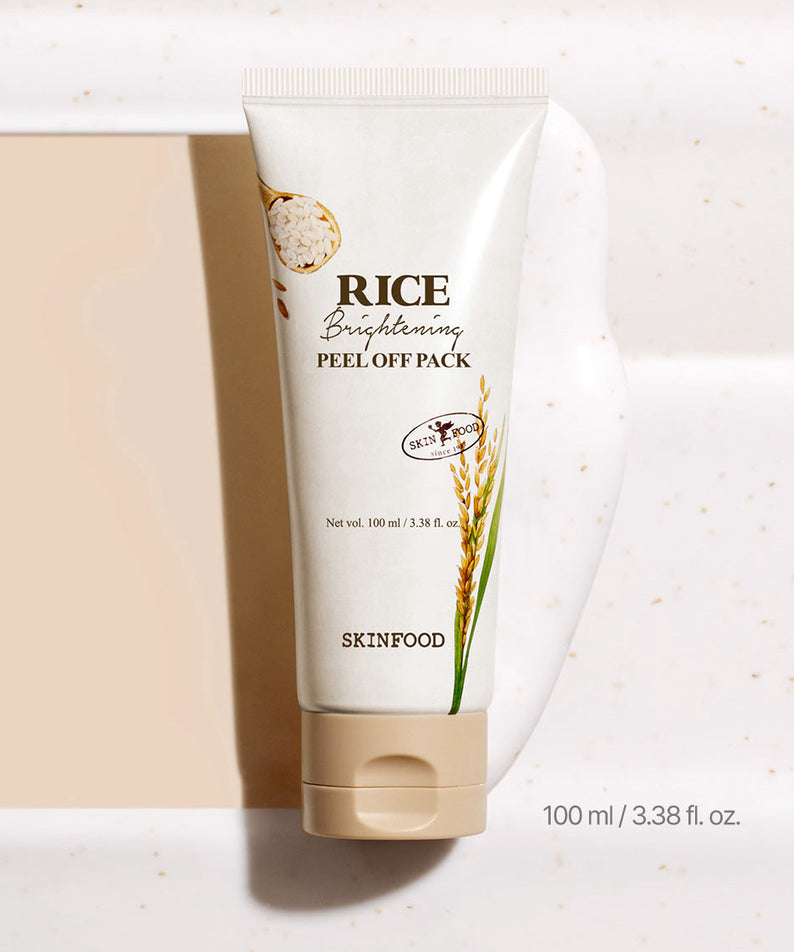 SKINFOOD [NEW] Rice Brightening Peel-Off Pack 100ml, tube crème blanc sur fond beige, packaging SKINFOOD.