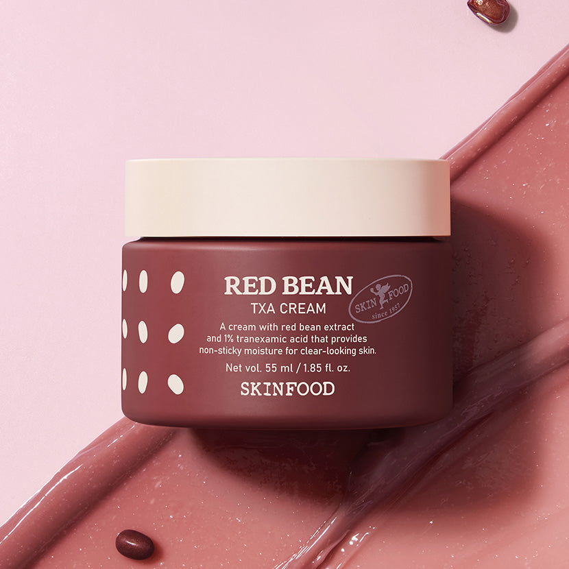 SKINFOOD Red Bean Tranexamic Acid Cream 55ml de la marque SKINFOOD, pot sur fond rose, crème rouge et gouttes