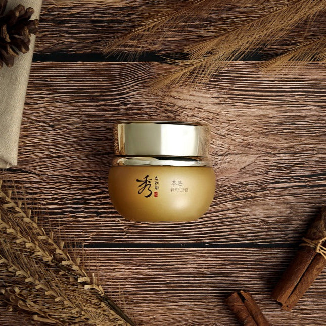 SOORYEHAN Bon Elasticity Cream 75ml : crème pour élasticité, pot doré sur fond bois et herbes, marque SOORYEHAN.
