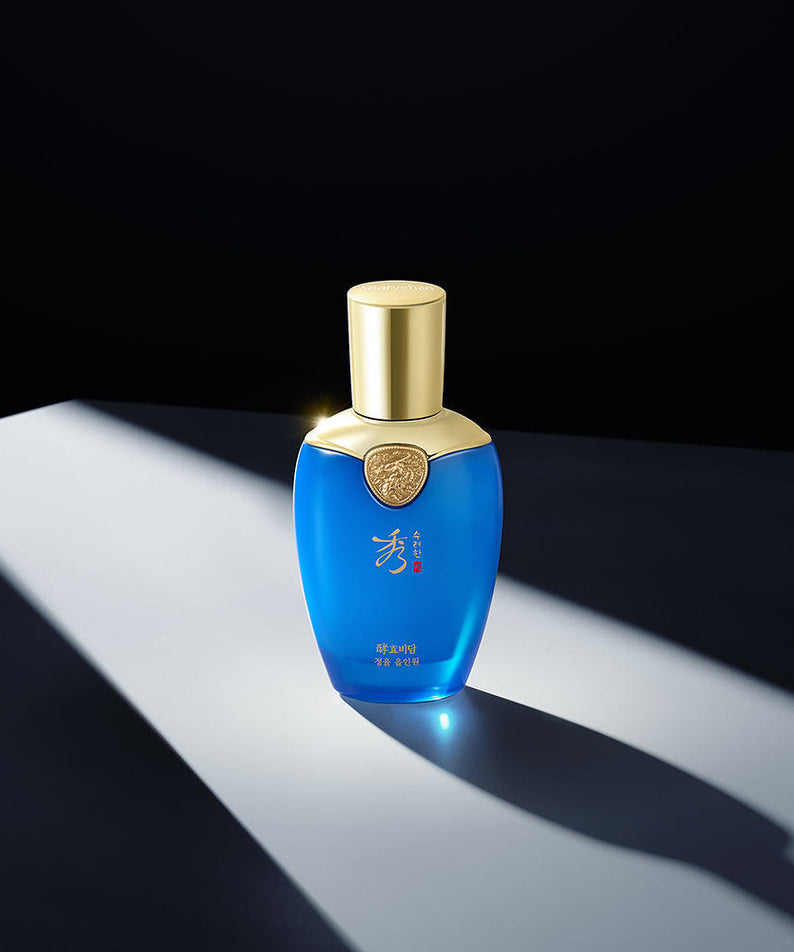 SOORYEHAN Hyobidam Jeongyul All-in-One 100ml de SOORYEHAN, flacon bleu sur fond noir avec lumière dorée