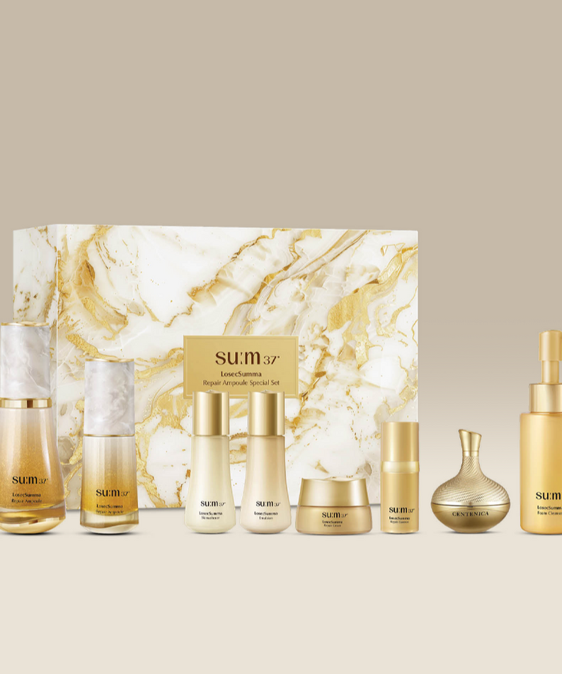 SU:M37 LosecSumma Repair Ampoule Planning (Set) par SU:M37, flacons et coffret sur fond marbre beige, visuel produit.