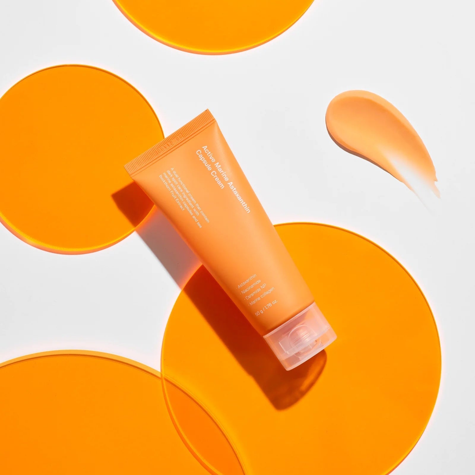 SUNGBOON EDITOR Active Marine Astaxanthin Capsule Cream 50g, crème tube orange sur fond blanc avec capsules, marque SUNGBOON.