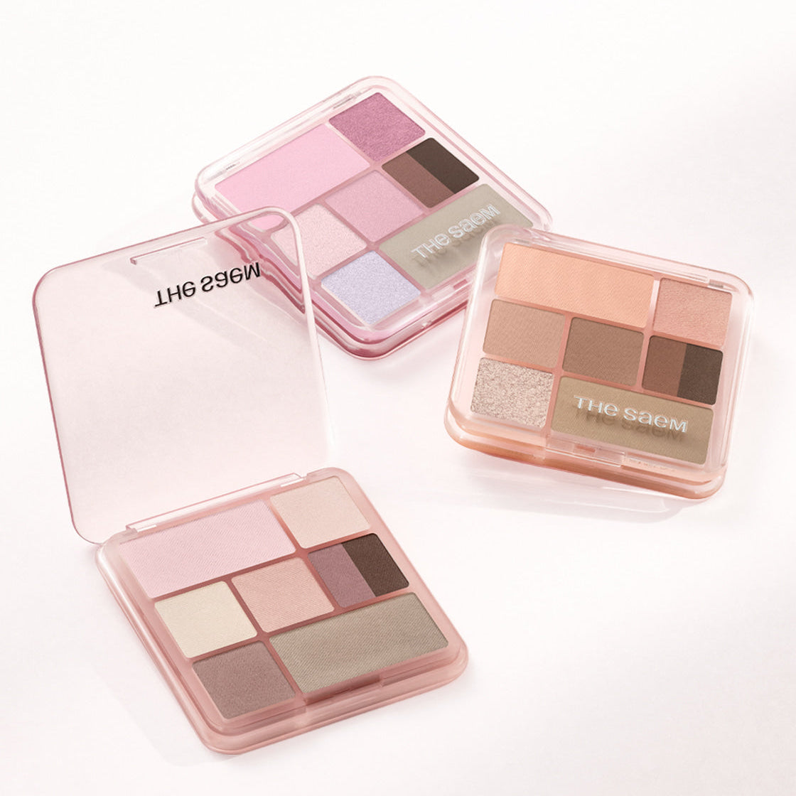 THE SEAM Shadow Box Palette de la marque The Saem, palette d’ombres en boîtiers transparents sur fond clair.