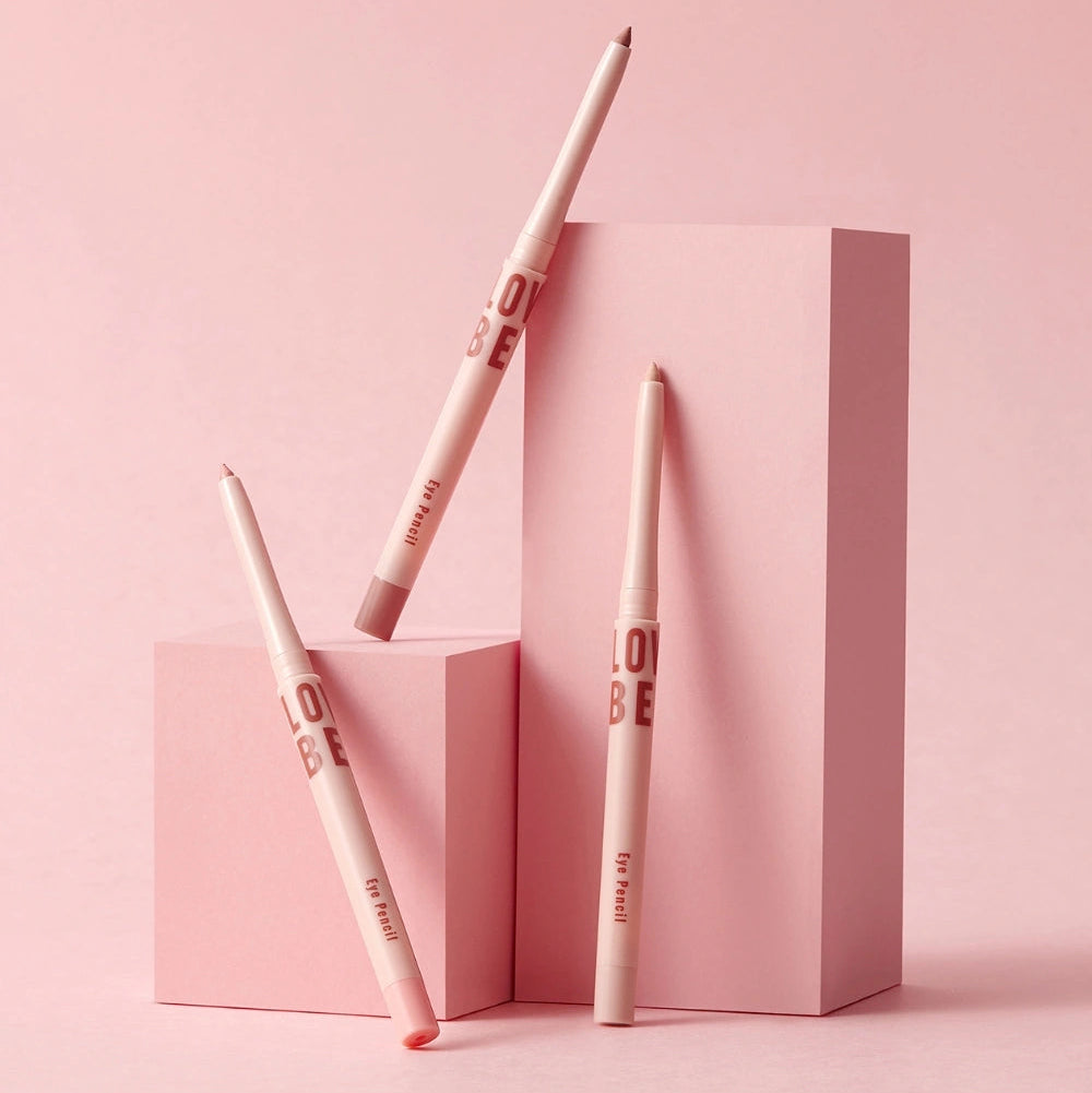 TONY MOLY Aegyo Beam Drawing Pencil de la marque TONY MOLY, stylos maquillage sur fond rose, packaging graphique.