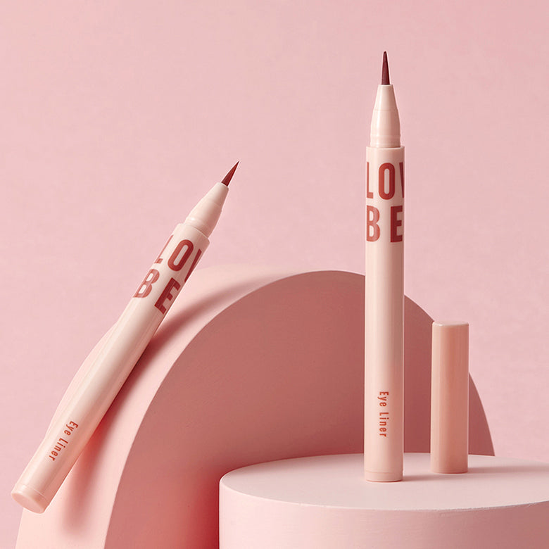 TONY MOLY Aegyo Beam Soft Liner de la marque TONY MOLY, maquillage yeux en tube nude sur fond rose pastel