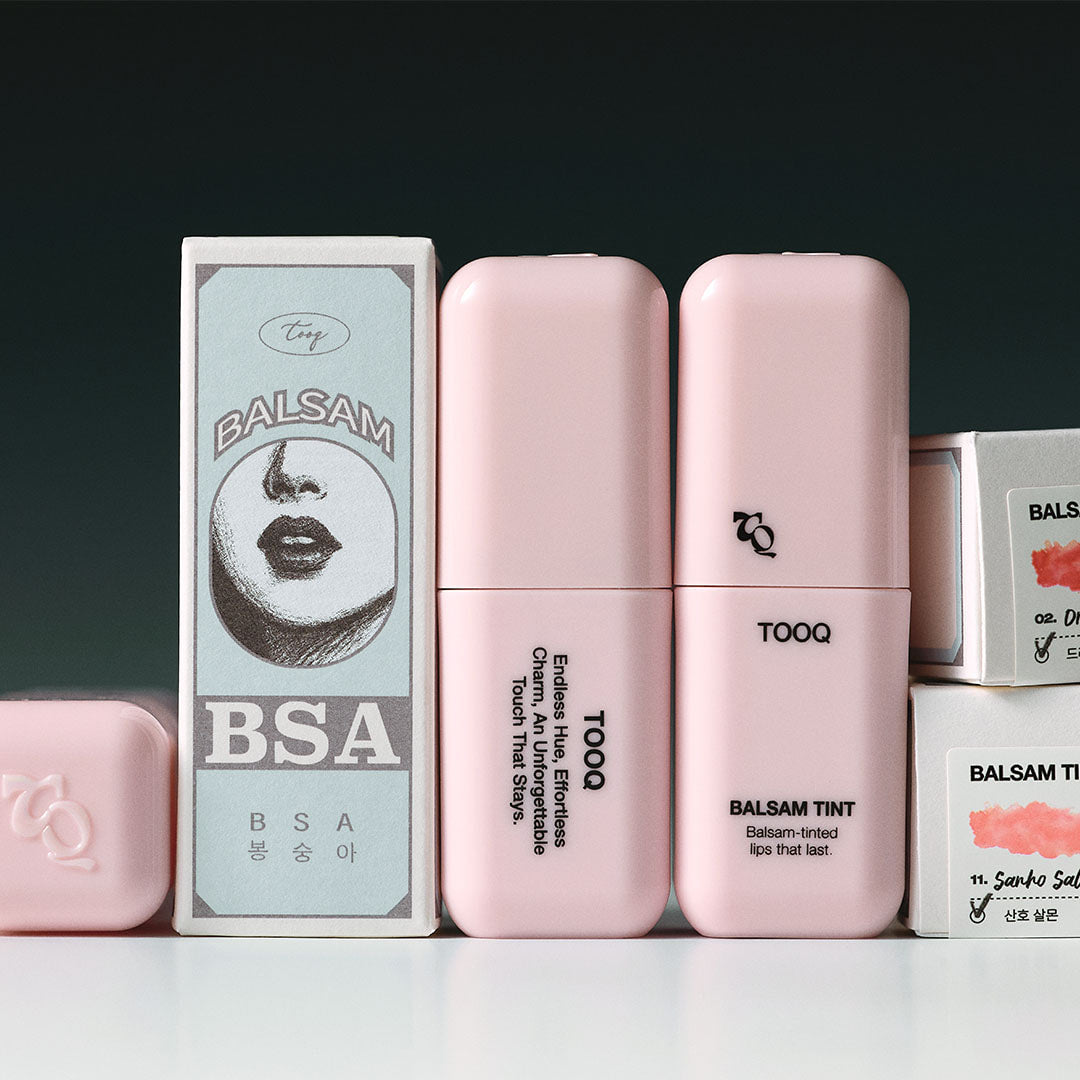 TOOQ Balsam Tint de TOOQ, tints pour lèvres en boîtes et tubes roses sur fond sombre, photo produit
