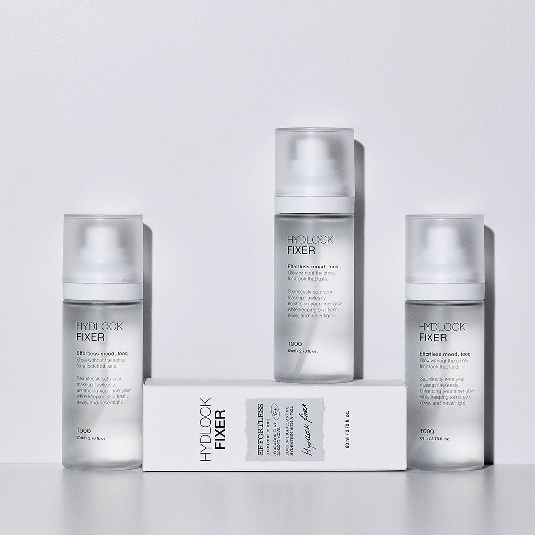 TOOQ Hydrock Fixer 80ml de la marque TOOQ, flacons et boîte sur fond clair, studio beauté, présentation produit.
