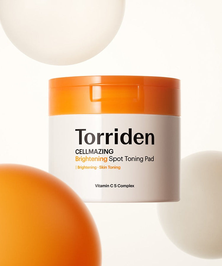 Décris l'image en français : TORRIDEN Cellmizing Vita C brightening Trace Toning Pads 70 sheets, pot blanc/orange sur fond clair.