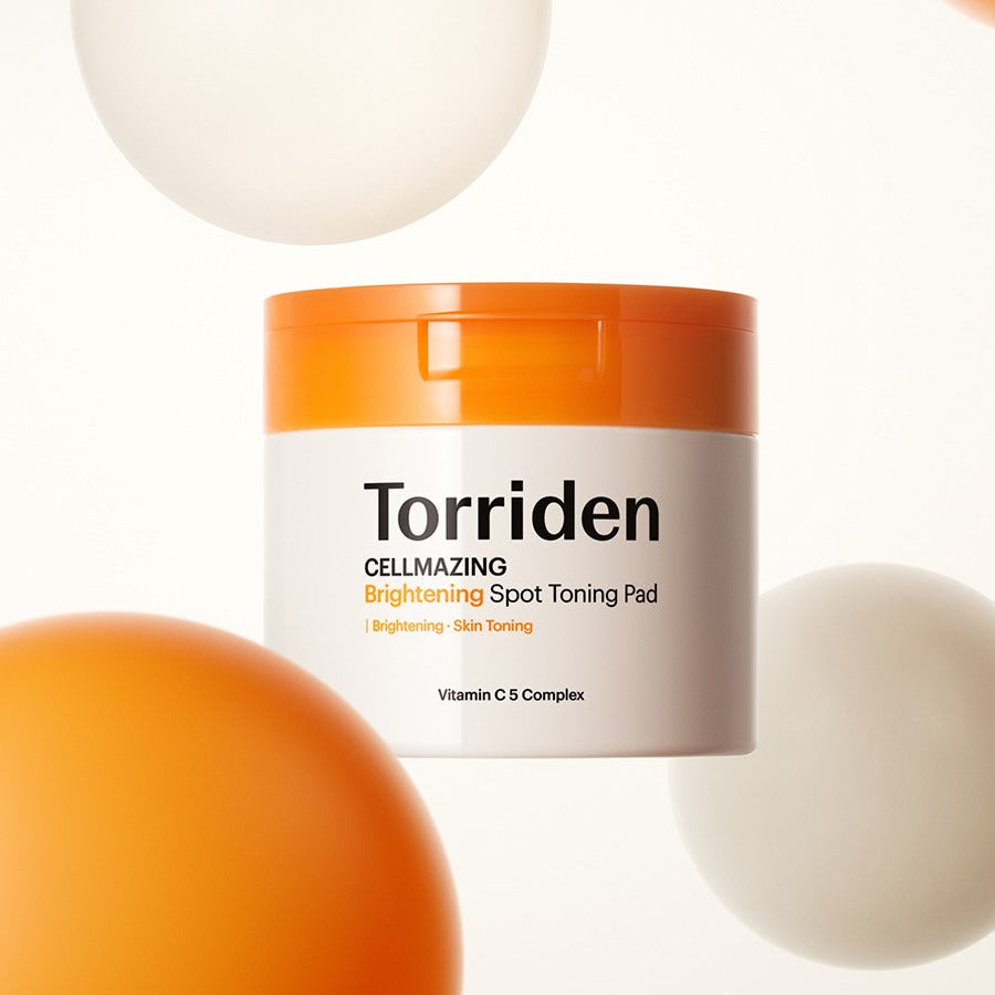 Décris l'image en français : TORRIDEN Cellmizing Vita C brightening Trace Toning Pads 70 sheets, pot blanc/orange sur fond clair.