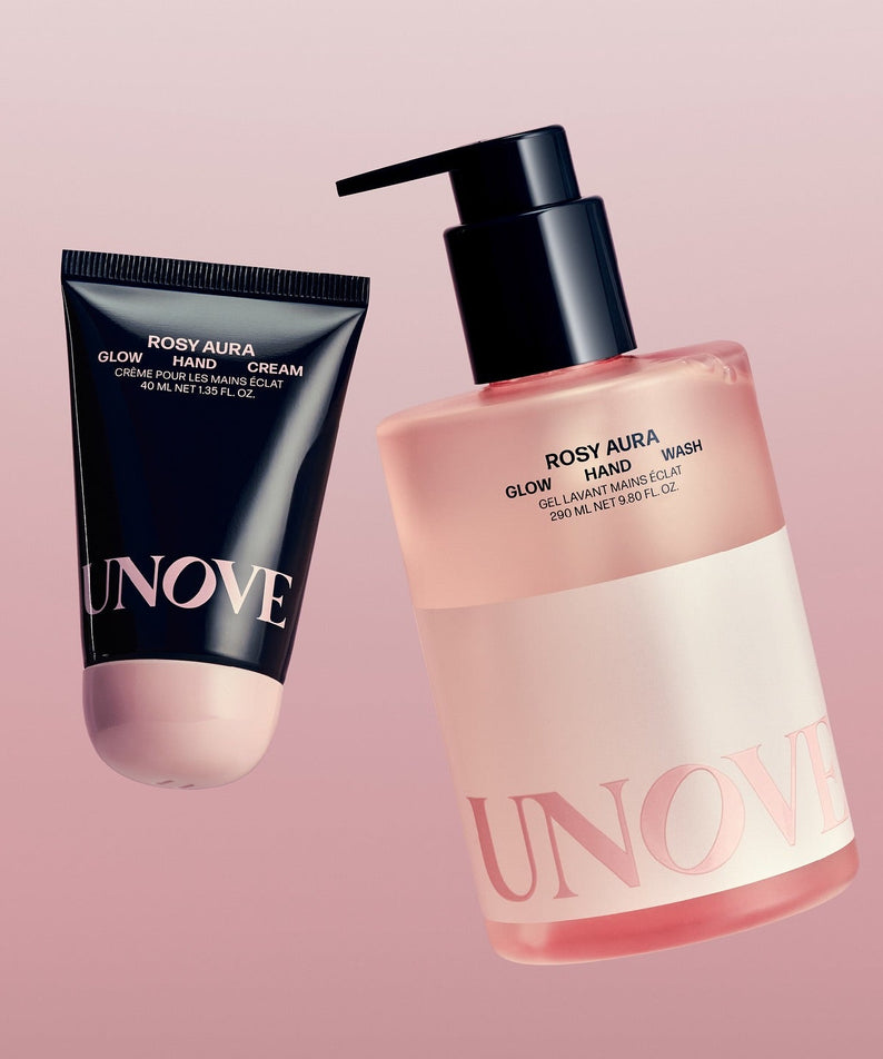 UNOVE Glow Hand Wash 290ml de la marque UNOVE, flacon-pompe et tube, sur fond rose pastel, produit cosmétique.