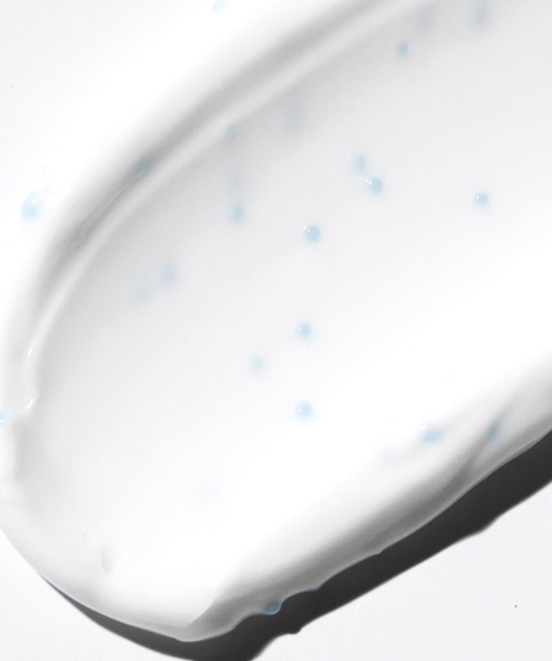 VT COSMETICS PDRN Cream RX 60ml, photo en gros d’une crème blanche sur fond clair, texture et gouttes visibles.