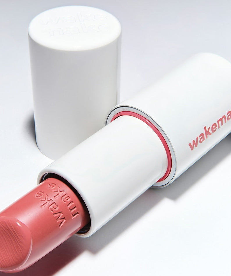WAKEMAKE Healthy Glow Balm Sticks, baume glow hydratant de la marque WAKEMAKE, en sticks blanc et rose sur fond clair.