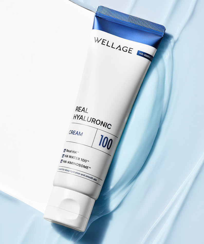 WELLAGE Real Hyaluronic 100 Cream 80ml en tube sur fond bleu, crème hydratante visible, marque WELLAGE