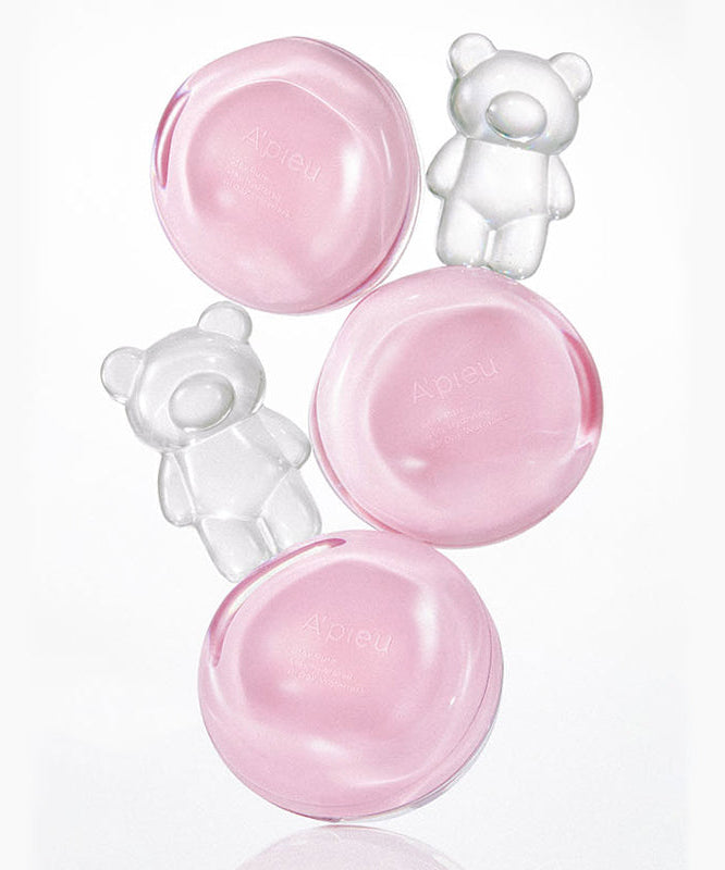 Composants du produit A'PIEU Waterlock Comfort Veil Cushion 15g avec design d'ours en arrière-plan.