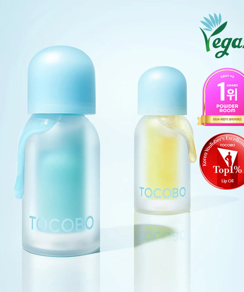 TOCOBO Juicy Berry Pluming Lip Oil de TOCOBO, visuel bleu-rose sur fond clair, flacons à la lumière, vegan