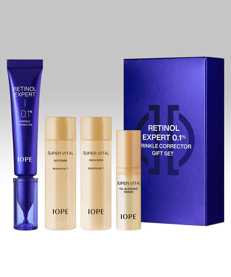 Ensemble IOPE Retinol Expert 0.1% Wrinkle Corrector 30ml, soin anti-rides, tube et flacons de soin devant boîte violette élégante.